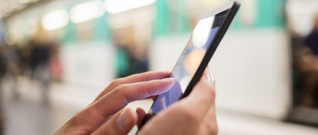 Woman-Using-Her-Cell-Phone-Subway