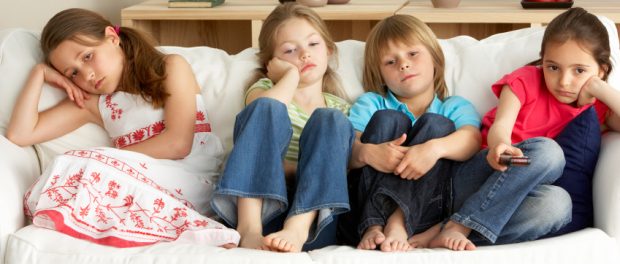 Young Children Watching Television at Home